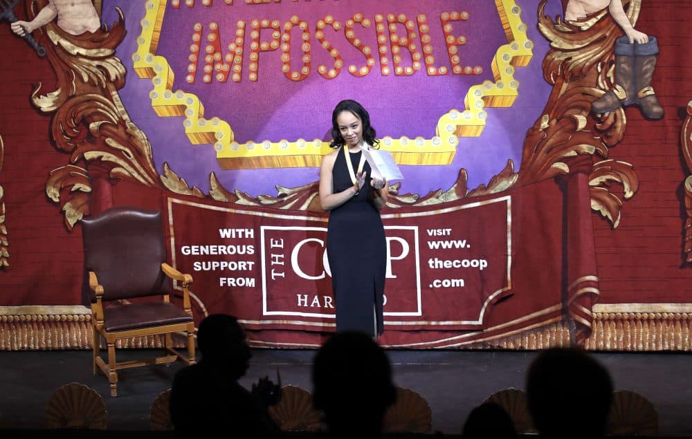 Amira Weeks, president of the Hasty Pudding theatre troupe, addresses the audience prior to presenting Mila Kunis. (Charles Krupa/AP)