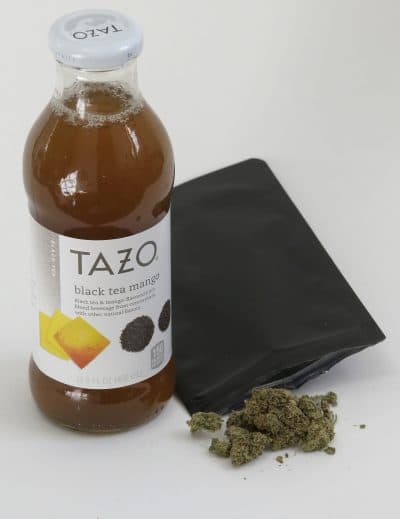 In this 2017 photo, a bottle of tea and marijuana from HighSpeed juice delivery service rest together in Walpole, Mass. (Steven Senne/AP)