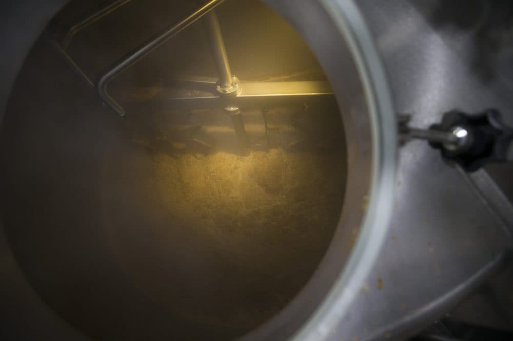 The wort for the Pink Boots Are Made For Walkin Hoppy Wheat Beer being mixed in the mash tun. (Jesse Costa/WBUR)