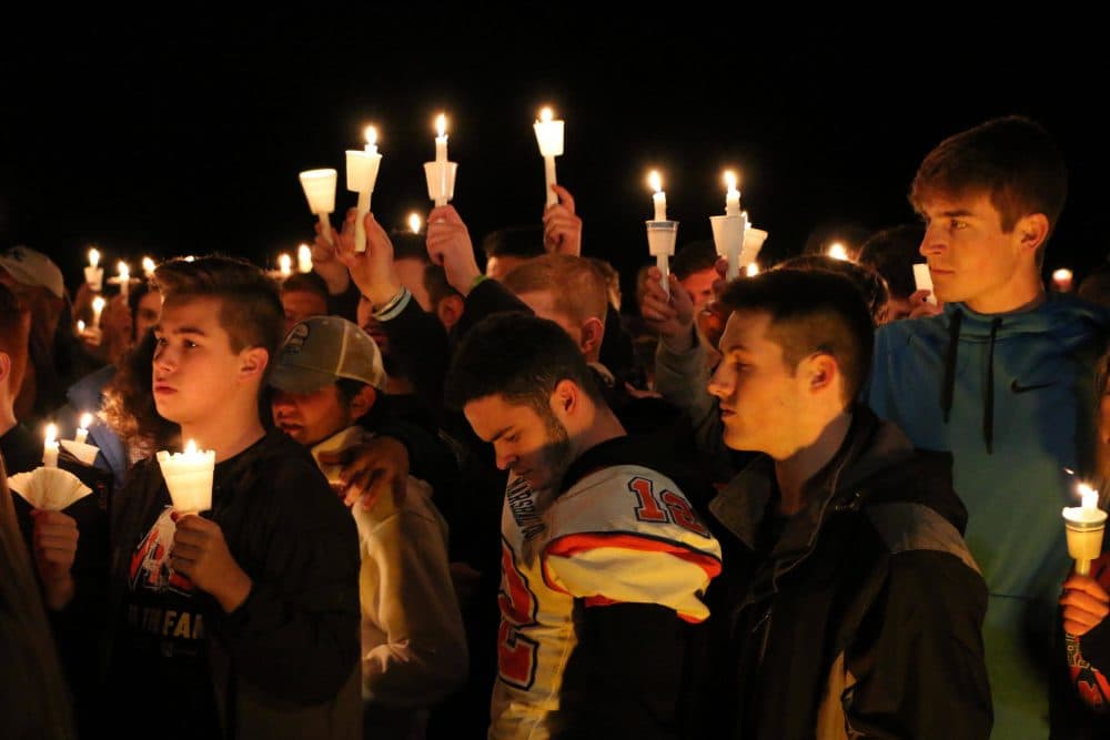 People attend a vigil for the victims of a fatal shooting at Marshall County High School on Thursday, Jan. 25, 2018, at Mike Miller County Park in Benton, Ky. A 15-year-old was accused of the fatal shooting, which left over a dozen injured. (AP Photo/Robert Ray)