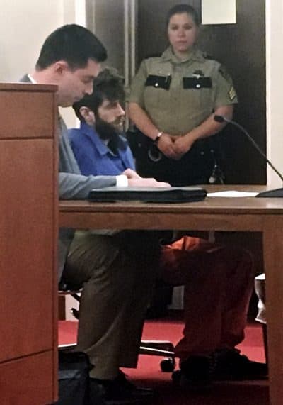 John Williams, center, accused in the fatal shooting of Somerset County Sheriff's Deputy Eugene Cole, sits with an attorney during his initial court appearance on a murder charge on Monday. He was ordered held without bail. (Marina Villeneuve/AP)