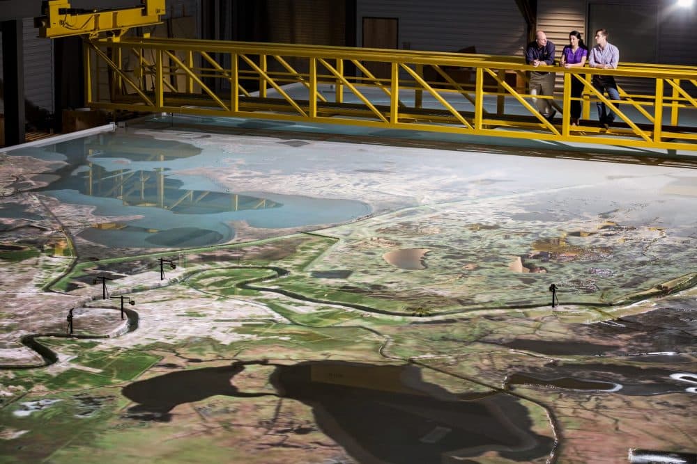 LSU Center for River Studies Director Clint Willson and graduate students conduct research on the river model. (Courtesy LSU)