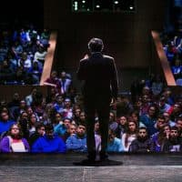 John Broderick, a former chief justice of the New Hampshire Supreme Court, speaks to high school students in Salem, N.H., about mental health awareness. (Jesse Costa/WBUR)