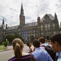 In this July 10, 2013, file photo, prospective students tour Georgetown University's campus in Washington. (Jacquelyn Martin/AP)
