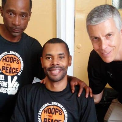 Former US Secretary of Education Arne Duncan (right) joined former All-City hooper Jimmy Sanders (left) and Shawn Harrington at a recent Hoops for Peace event in Chicago. (Michael James)