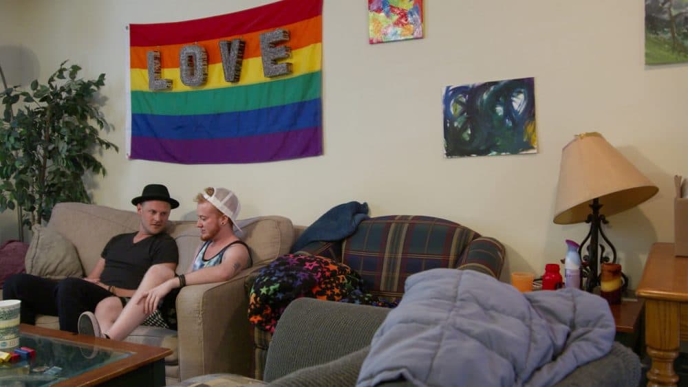 "Queer Eye" design expert Bobby Berk sits with Skyler, in a still from season two of Netflix's "Queer Eye." (Courtesy of Netflix)
