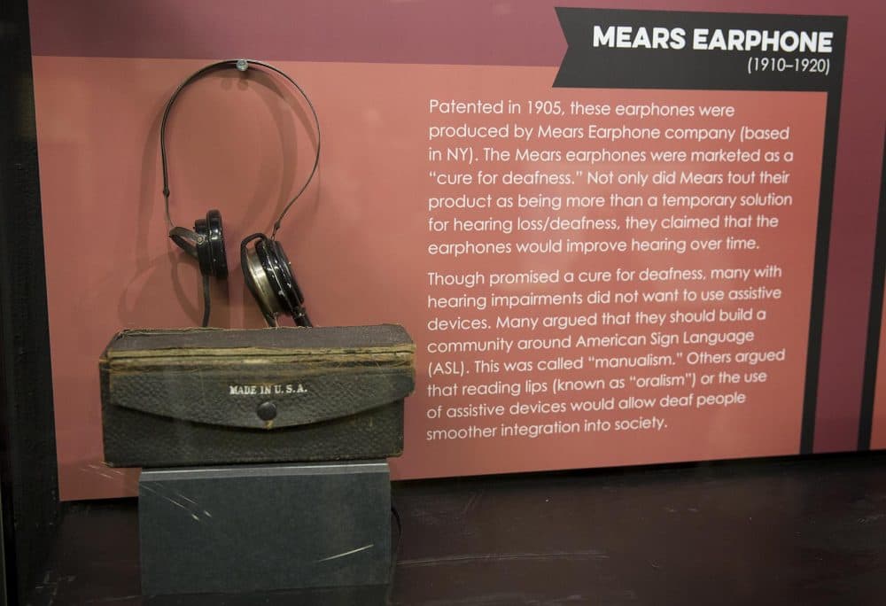 A Mears earphone is included in a part of the exhibit titled "Towards Independence and Inclusion." (Robin Lubbock/WBUR)