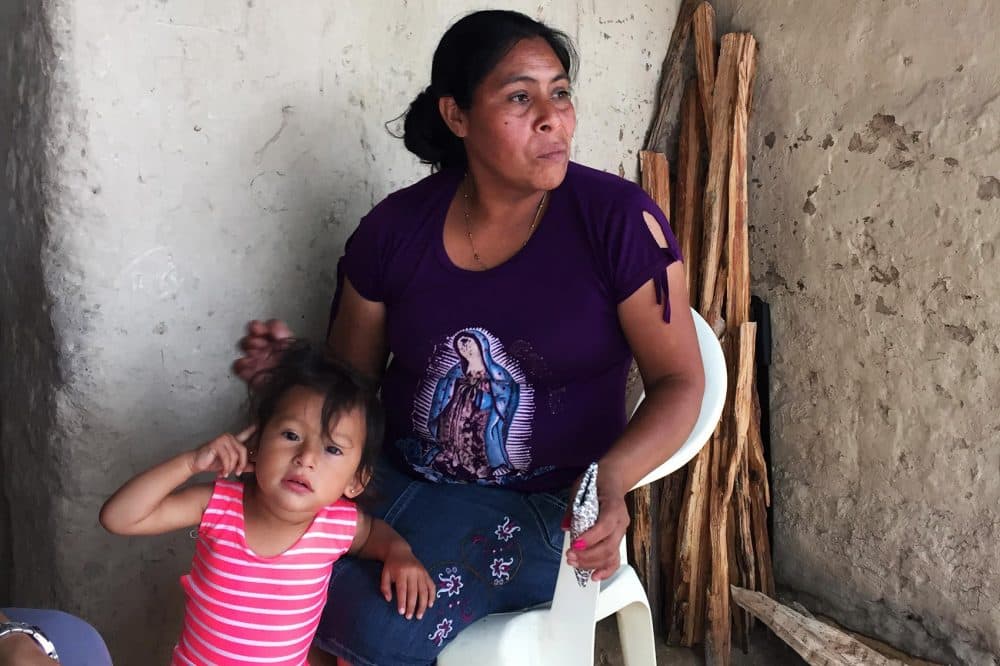 Ludis Marleny Rodriguez sits with her youngest daughter. (Karyn Miller-Medzon/Here & Now)