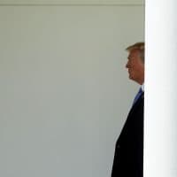 President Trump walks along the Rose Garden colonnade after he and first lady Melania Trump returned to the White House on July 18, 2018 in Washington, D.C. (Chip Somodevilla/Getty Images)