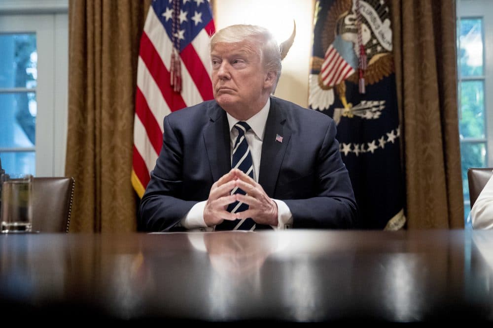 President Donald Trump waits for members of the media get set up before speaking in the Cabinet room of the White House Tuesday