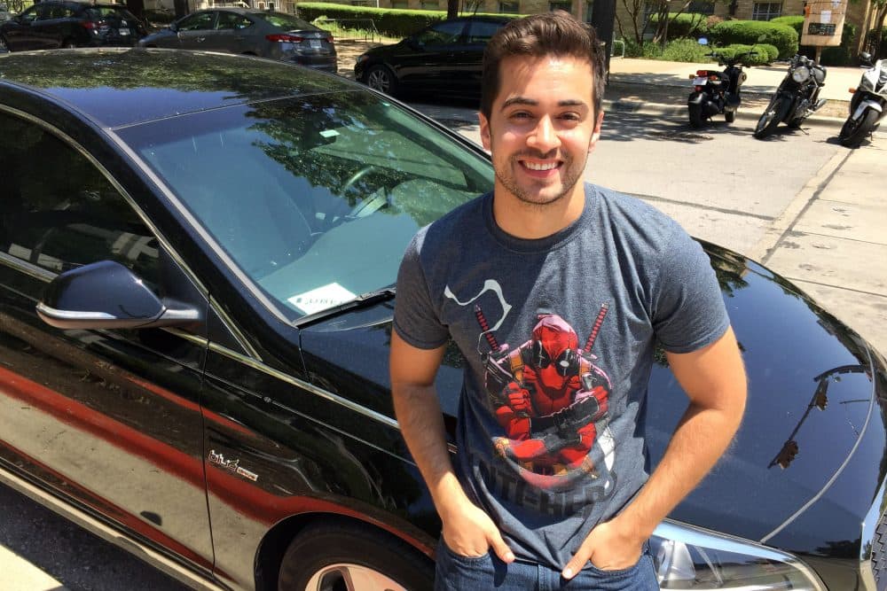 Paul Christian with his car in Austin. (Ashley Bailey/Here & Now)