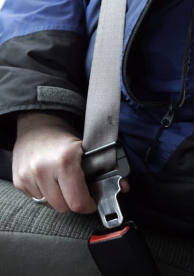 A person buckles up in Bethel, Maine in 2008. (Pat Wellenbach/AP)