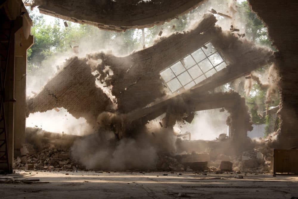 In this Saturday, Aug. 4, 2018 photo, walls of Chinese artist Ai Weiwei's studio collapse during demolition in Beijing. (Ng Han Guan/AP)