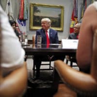 President Donald Trump smiles during a discussion for drug-free communities support programs, in the Roosevelt Room of the White House, Wednesday, Aug. 29, 2018, in Washington. (Alex Brandon/AP)