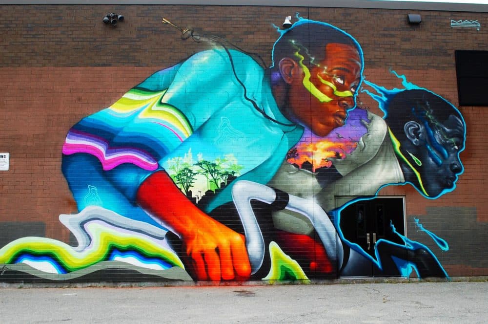 Max Sansing's mural in Worcester honors American track cyclist Marshall Walter "Major" Taylor. (Dana Forsythe for WBUR)