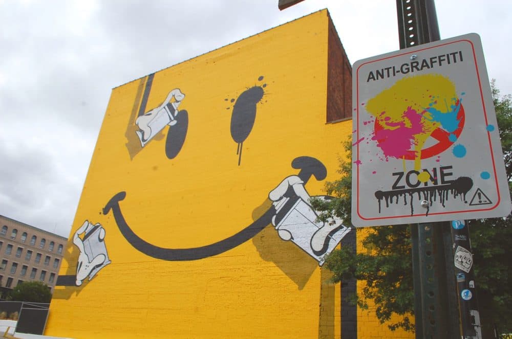 Artist OG Slick's mural for Pow! Wow! Worcester. (Dana Forsythe for WBUR)