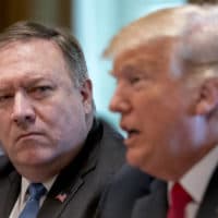 President Donald Trump, accompanied by Secretary of State Mike Pompeo, left, speaks during a cabinet meeting in the Cabinet Room of the White House, Thursday, Aug. 16, 2018, in Washington. (AP Photo/Andrew Harnik)