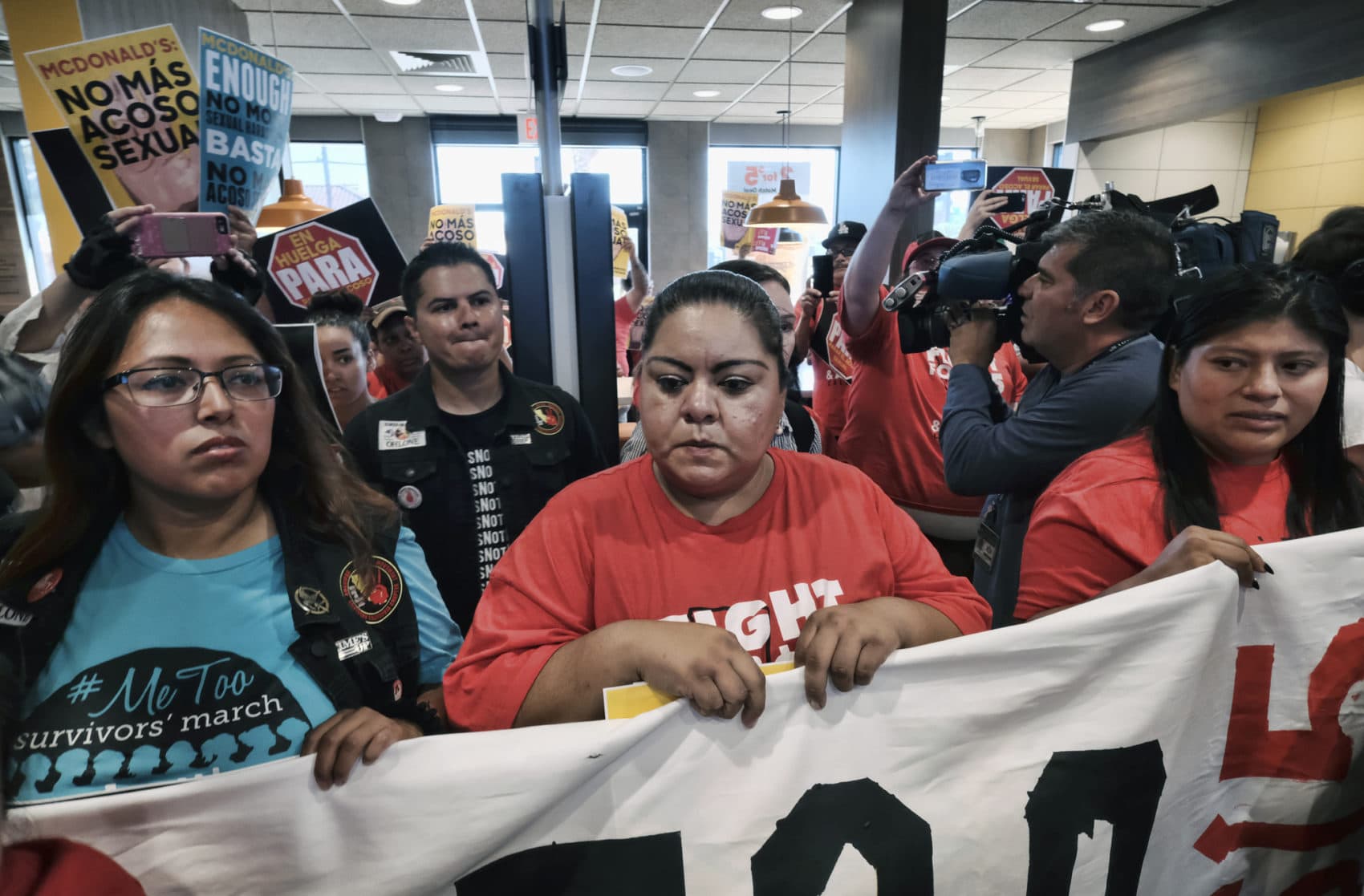 McDonald's workers protest inside of a McDonalds resturant in south Los Angeles on Tuesday, Sept. 18, 2018 (Richard Vogel/AP)