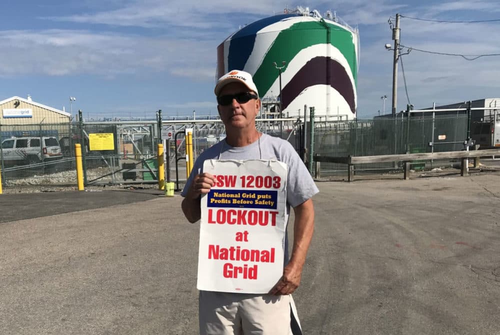 Paul Baskiewicz stands at the tank, where he is National Grid's crew chief. (Bruce Gellerman/WBUR)