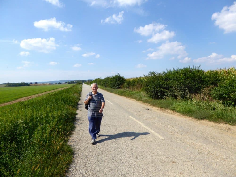 Tomi Reichental walking on the road in Slovakia near his hometown of Merašice in summer 2016. (Courtesy)