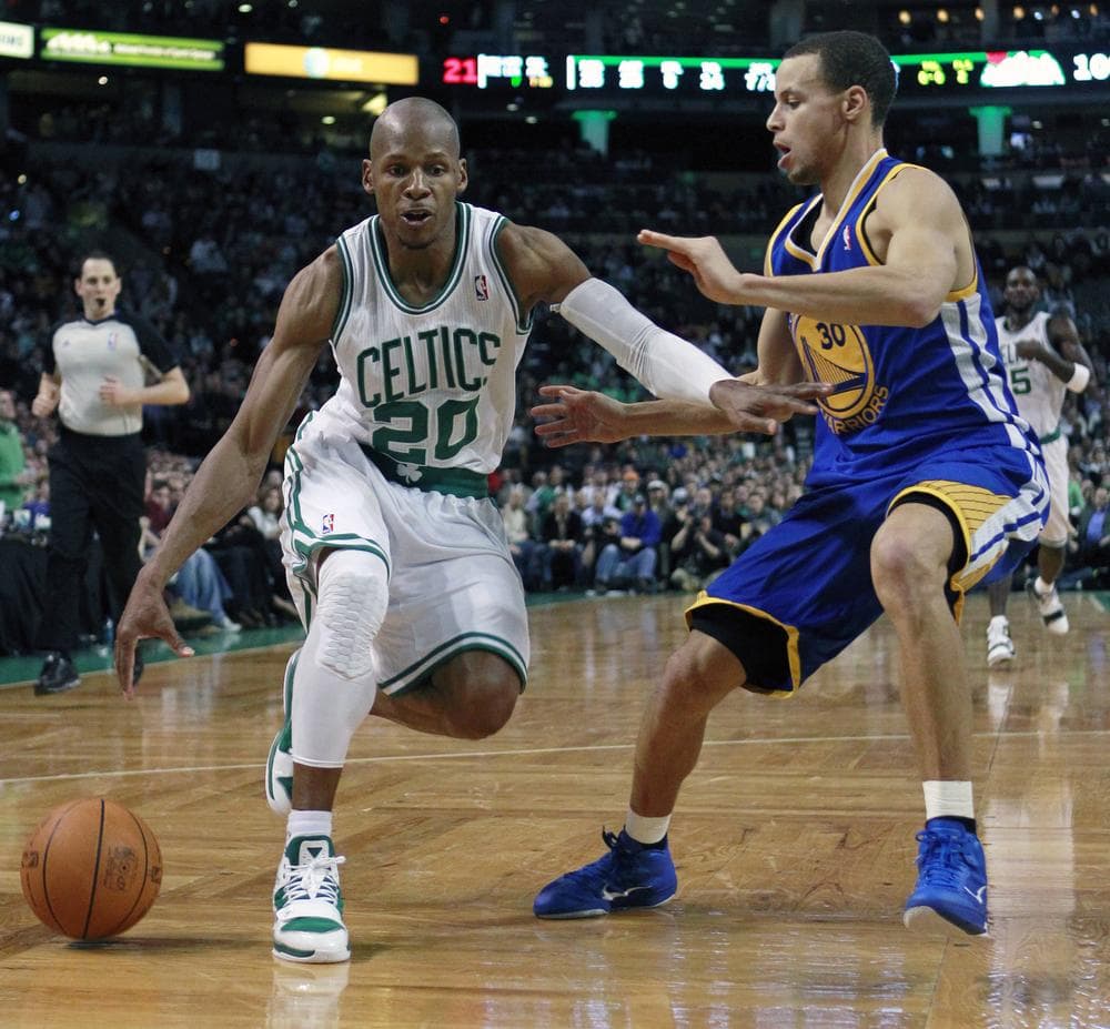 Stephen Curry guards Ray Allen in-game.