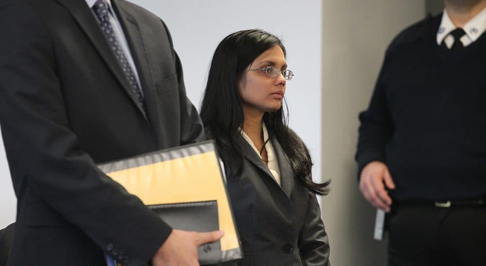 So what are we going to do about it now? Carol Rose and Matthew Segal argue there's only one way to rebalance the scales of justice in Massachusetts. In this photo, former state lab chemist Annie Dookhan, center, stands in Middlesex Superior Court for arraignment on Wednesday, Jan. 9, 2013. (Suzanne Kreiter/ AP)