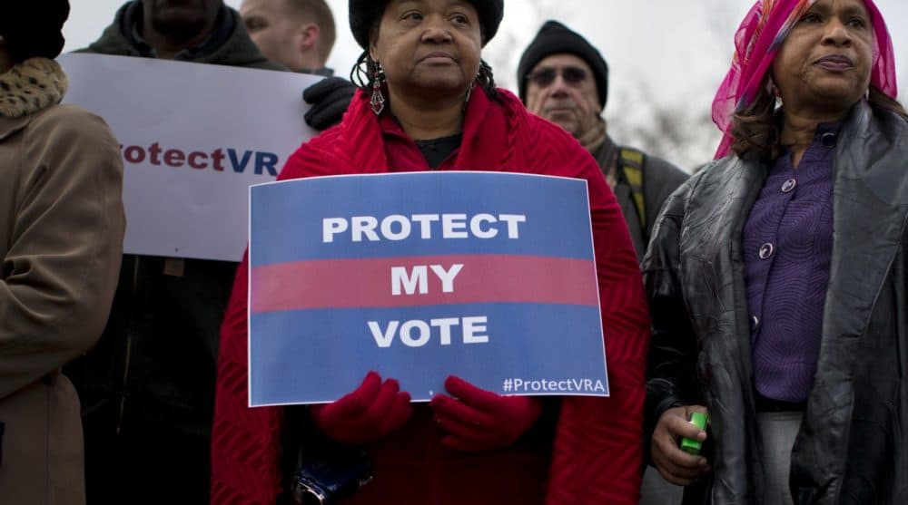 People wait in line outside the Supreme Court in Washington, Wednesday, Feb. 27, 2013, to listen to oral arguments in the Shelby County, Ala., v. Holder voting rights case. The Supremec Court is expected to release its decision in the coming weeks. (Evan Vucci/AP)