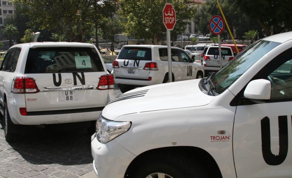 A U.N. team scheduled to investigate an alleged chemical attack leaves its hotel in a convoy, in Damascus, Syria, Monday, Aug. 26, 2013. (AP)