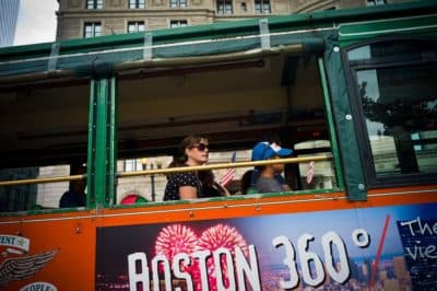 Tourists take in the scenes around Copley Square via trolley. (Dominick Reuter for WBUR)