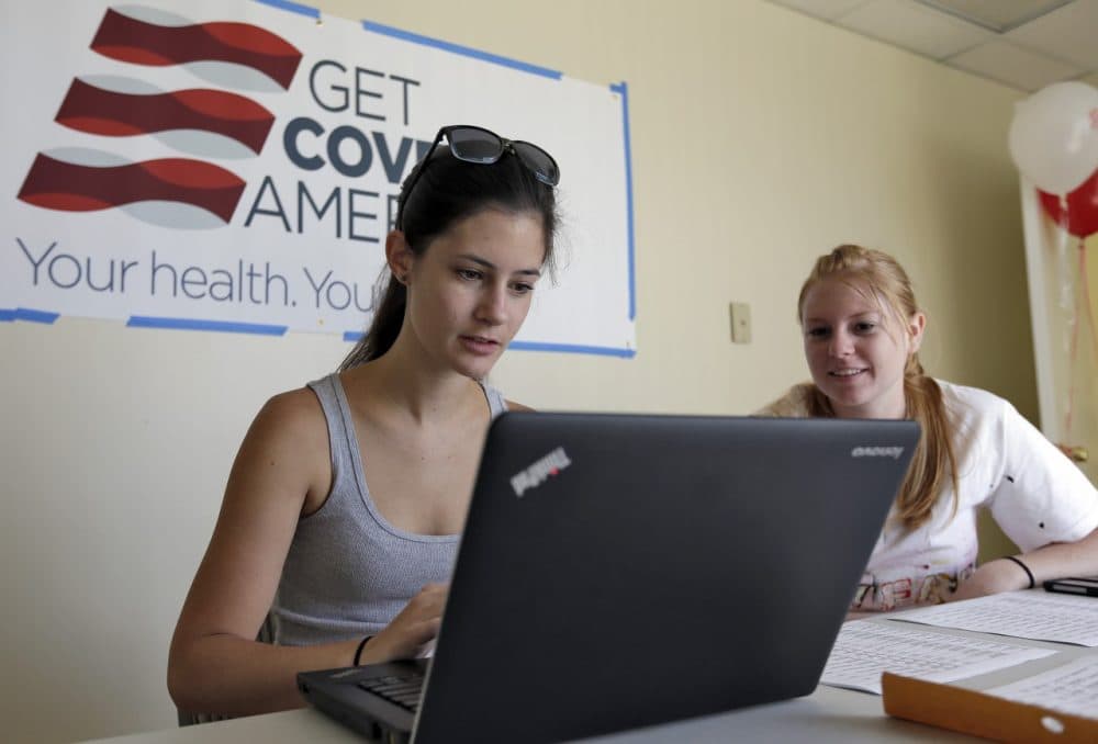Ashley Hentze, left, of Lakeland, Fla., gets help signing up for the Affordable Care Act from Kristen Nash, a volunteer with Enroll America, a private, non-profit organization running a grassroots campaign to encourage people to sign up for health care, Tuesday, Oct. 1, 2013 After months of build-up, Florida residents can start shopping for health insurance on government-run online marketplaces as the key component of the Affordable Care Act goes live. (Chris O'Meara/AP)