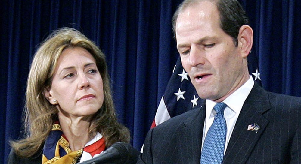 Eliot Spitzer and his wife, Silda Wall Spitzer, are divorcing after more than two decades of marriage. This has Hinda Mandell rethinking the sex-scandal script. In this March 12, 2008 file photo, New York Gov. Spitzer announces his resignation amid a prostitution scandal as his wife Silda stands by at the governor’s office in New York. (Stephen Chernin/AP)