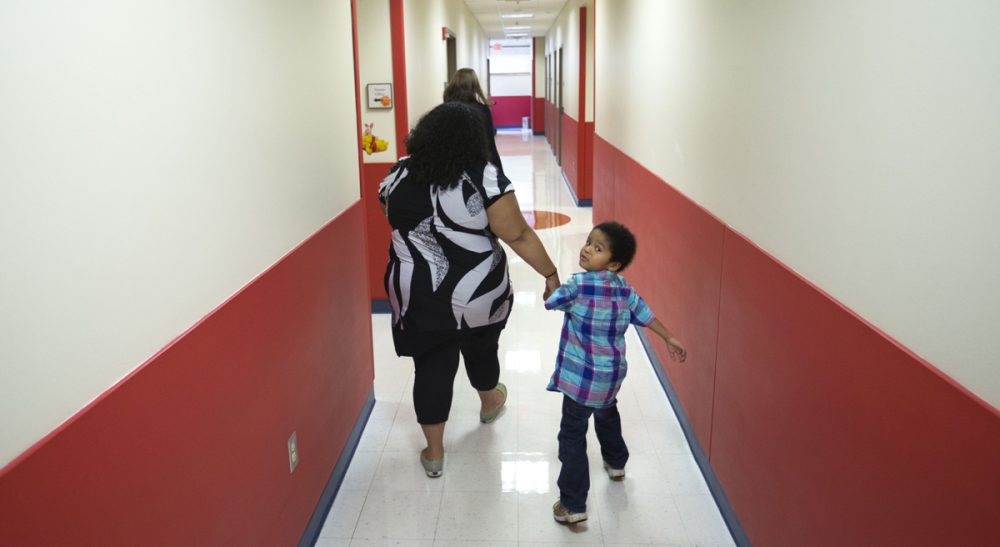 Susan Senator: In the fight between autism advocates, I take only one side: my son’s. In this photo, Marlaina Dreher, left, walks with her 5-year-old son, Brandon, at the Marcus Autism Center, Wednesday, Sept. 18, 2013, in Atlanta. (David Goldman/AP)
