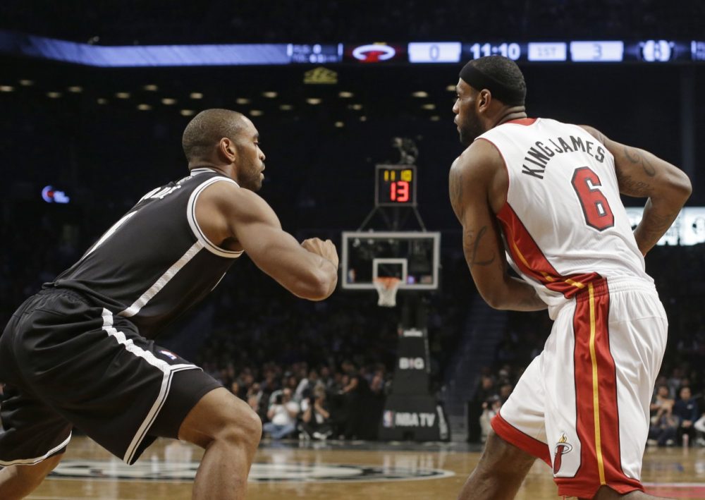 The Heat and Spurs debuted nickname jerseys.  Here LeBron "King James" James faces off against Alan "Double" Anderson. (Frank Franklin II/AP)