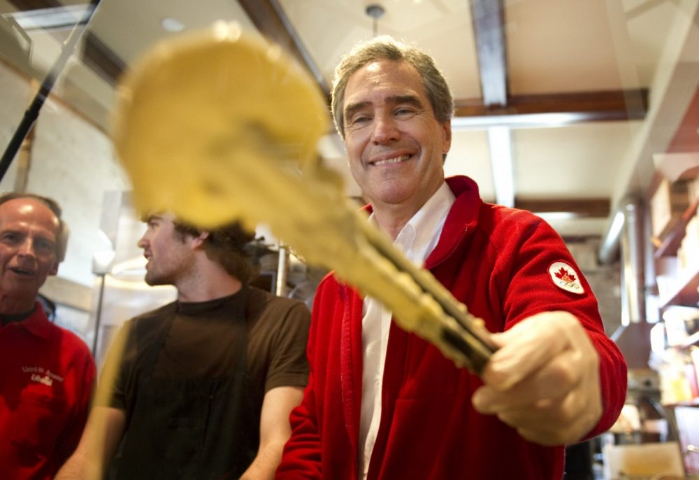Liberal Leader Michael Ignatieff dunks a slide of apple in batter to make an apple fritter Saturday, April 30, 2011 in Paris, Ont. (Paul Chiasson/AP)