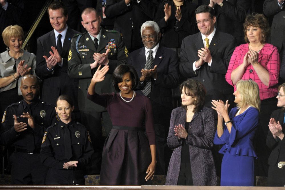 As First Lady Michelle Obama waves, Indiana business owner Trevor Yager can be seen in the top row, second from left, at the State of the Union address in 2010. (Susan Walsh/AP)