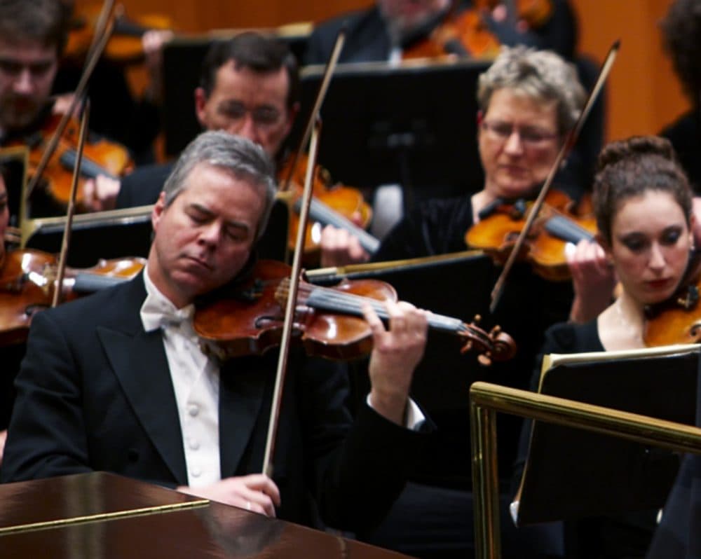 In this undated photo provided by the Milwaukee Symphony Orchestra, concertmaster Frank Almond plays a 300-year-old Stradivarius violin that was on loan to him during a concert in Milwaukee. (Milwaukee Symphony Orchestra via AP)