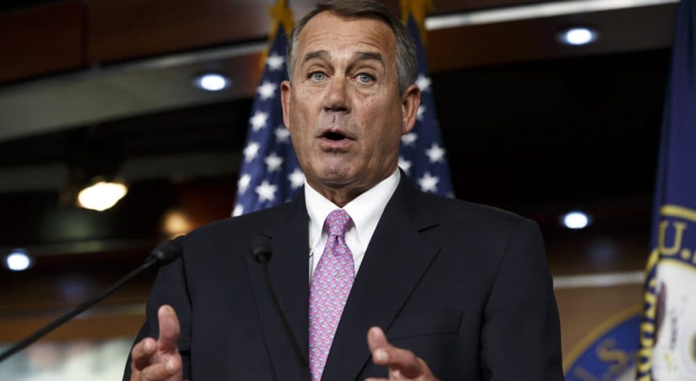 In this Feb. 6, 2014 file photo, House Speaker John Boehner of Ohio speaks during a news conference on Capitol Hill in Washington. In a concession to President Barack Obama and Democratic lawmakers, Boehner said the House would vote to increase the government's borrowing cap without trying to attach conditions sought by some Republicans. "We'll let his party give him the debt ceiling increase that he wants," Boehner said, hours before the vote. (Scott Applewhite/AP)