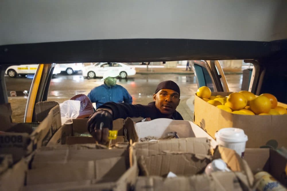 Nelson Bennett stocks the Pine Street Inn's outreach van with food and supplies. (Courtesy Rick Friedman)