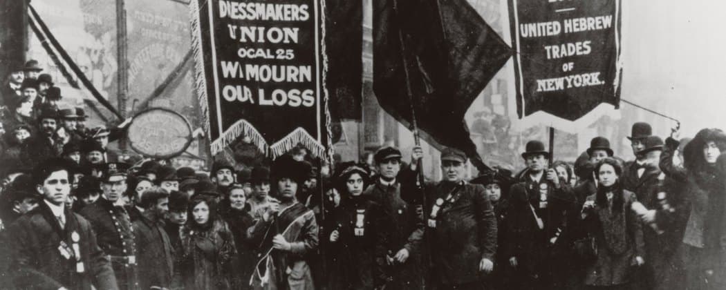 Workers gather after the 1911 Triangle Shirtwaist Factory fire in New York, which became a rallying cry for miserable working conditions. It's part of the backdrop for Alice Hoffman's "The Museum of Extraordinary things." (AP/National Archives)