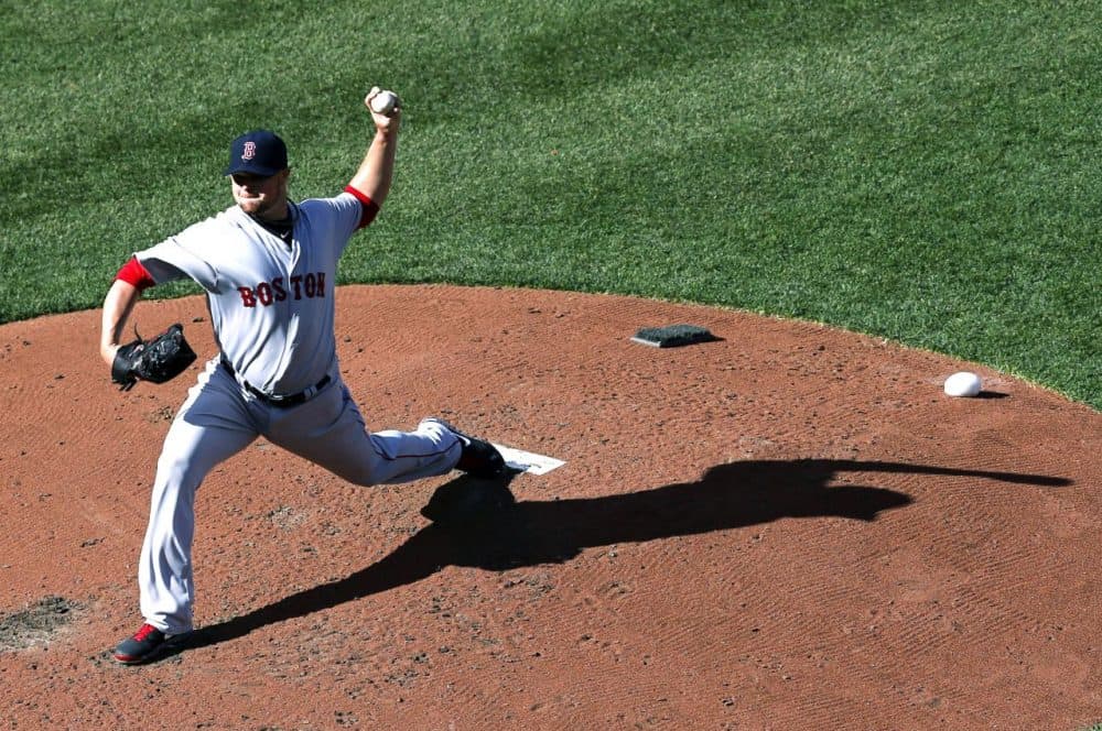 Boston Red Sox starting pitcher Jon Lester throws to the Baltimore Orioles in the fourth inning of an opening day baseball game in Baltimore. (Patrick Semansky/AP)