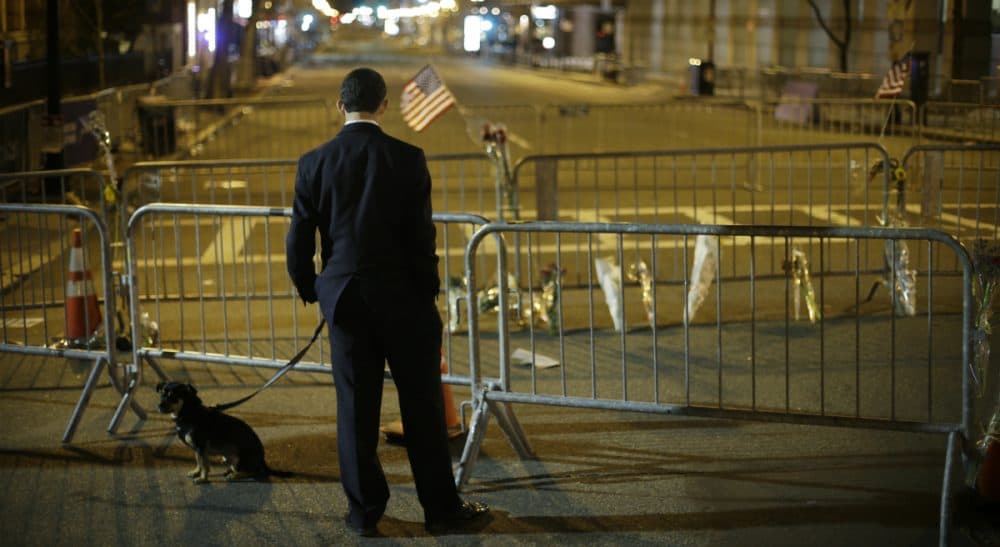Carol Rose: Let’s use the Marathon anniversary to reflect on lessons learned. In this photo, a man pauses on Boylston Street near the Marathon finish line, Wednesday, April 17, 2013. (Matt Rourke/AP)