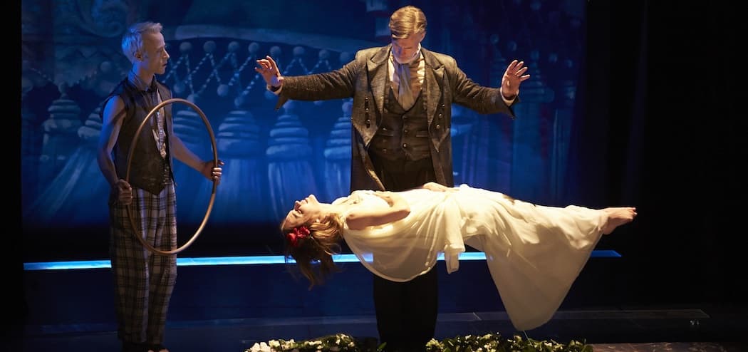 Prospero (Tom Nelis) levitates Miranda (Charlotte Graham) with Ariel (Nate Dendy) providing assistance. (Geri Kodey)