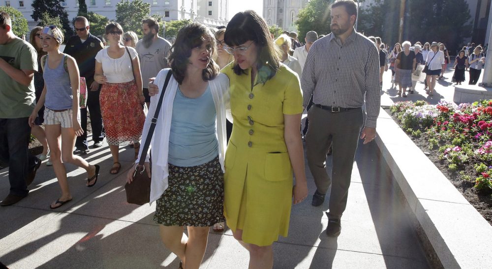 R. B. Scott: "The church is at an important crossroad in its 184-year history." Pictured: Kate Kelly, right, walks with a supporter after addressing her supporters at the Church Office Building of the Church of Jesus Christ of Latter-day Saints during a vigil Sunday, June 22, 2014, in Salt Lake City. Kelly was excommunicated from The Church of Jesus Christ of Latter-day Saints in June. (Rick Bowmer/AP)