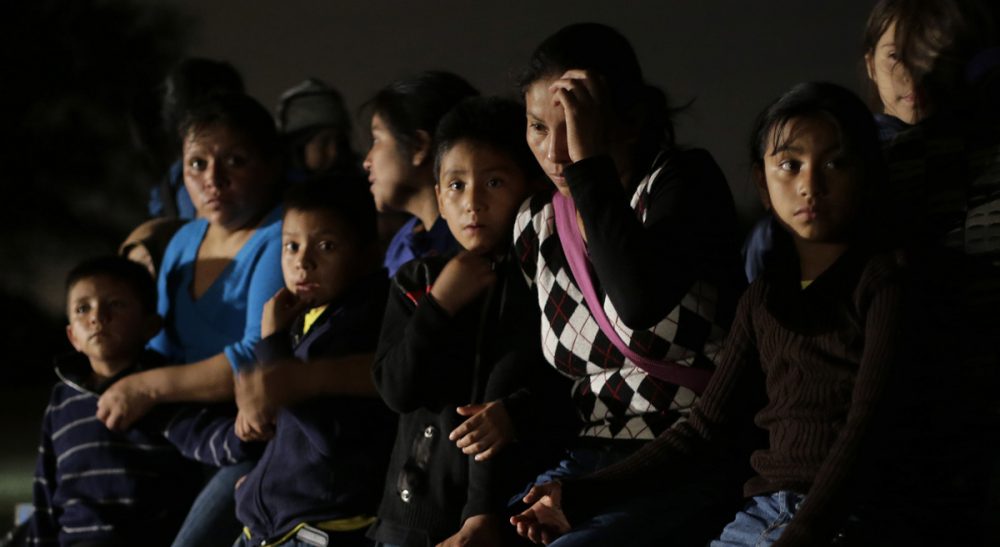 Fifty years ago, 14,000 Cuban children got a shot at better lives in America. On Monday, July 14, the Obama administration began deporting undocumented children to their native Honduras. Pictured: Women and children from Honduras and El Salvador who crossed the U.S.-Mexico border illegally are stopped in Granjeno, Texas in June, 2014. (Eric Gay, File/AP)