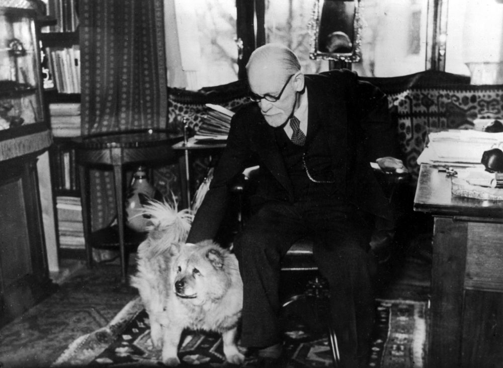 Austrian psychoanalyst Prof. Sigmund Freud and his dog "Jofi" in his office in Vienna, Austria, in 1937. (AP)