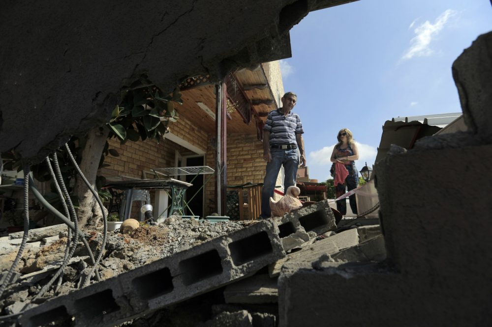 Barry Shrage: "No nation anywhere can be expected to tolerate assaults on its citizens, and Israel has every right to defend itself vigorously and decisively." Yerechmiel Steinberg looks at the damages of his home after a rocket fired by Palestinian militants in Gaza landed in the southern town of Sderot, Thursday, July 3, 2014. Israeli military carried out airstrikes on the Gaza Strip after Palestinian militants fired rockets into Israel early Thursday. The Israeli military said the air force struck 15 "terror sites" in Gaza. "The targets included weapons manufacturing sites as well as training facilities," a military spokesman said. (Tsafrir Abayov/AP)