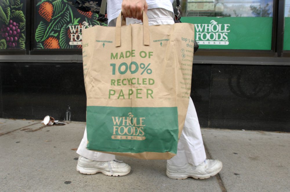A customer walks home from the Whole Foods Market in Cambridge, Mass. in 2008 around the time of another beef recall due to E. coli bacteria. (Josh Reynolds/AP)