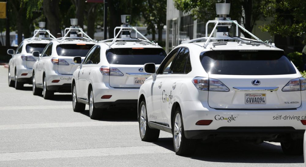 Tom LeCompte: "Even if engineers can teach robot cars to integrate with Boston drivers, what’s the fun of cutting off a robotic car or throwing it the finger." Pictured: In this photo taken Wednesday, May 14, 2014, a row of Google self-driving cars are shown outside the Computer History Museum in Mountain View, Calif.(Eric Risberg/AP)