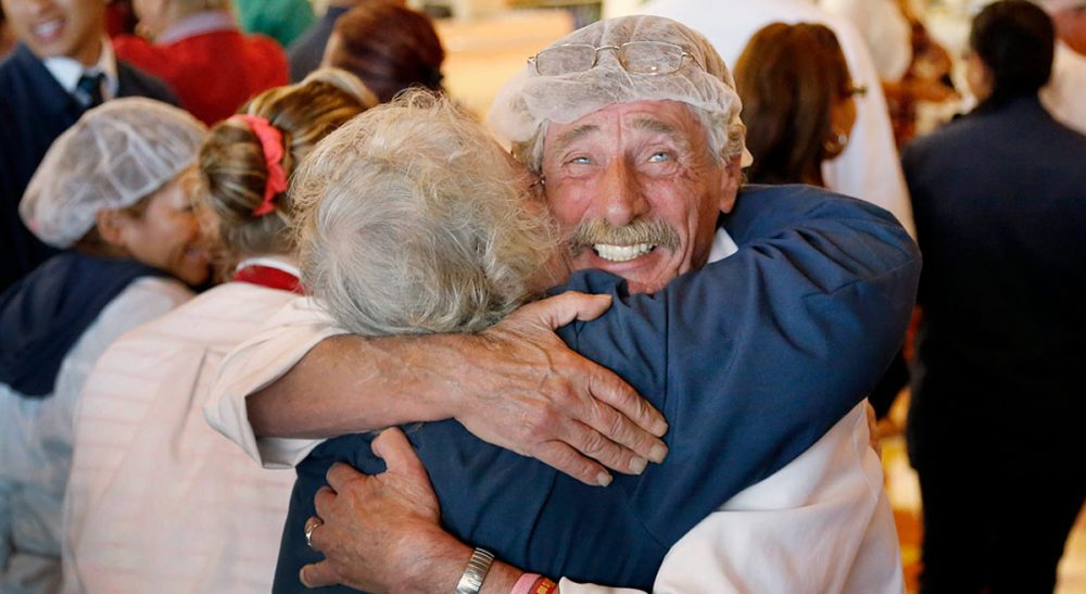 Thomas Kochan: "First and foremost an enormous thank you goes to the courageous and loyal employees and their families who stood up, together, for each other, for the culture Arthur T. nourished over the years and for fairness in business and employment practices." Pictured: Market Basket meat manager Bob Dietz, of Methuen, Mass., front right, hugs cashier Mary Olson, of Chelsea, Mass., after watching a televised speech by restored Market Basket CEO Arthur T. Demoulas at a store location, Thursday, Aug. 28, 2014, in Chelsea. (Steven Senne/AP)