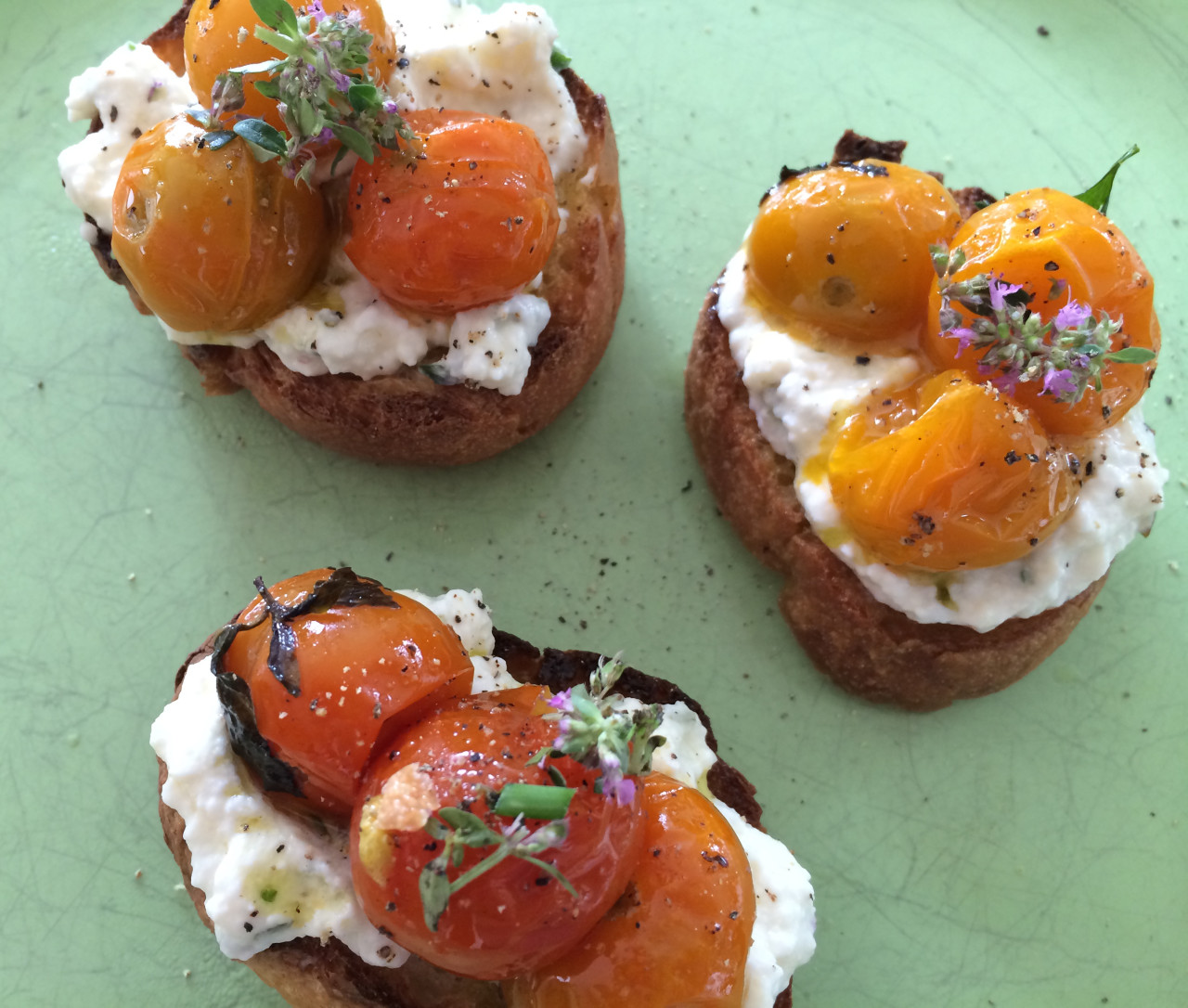 Ricotta toasts with slow-roasted tomatoes. (Kathy Gunst/Here & Now)